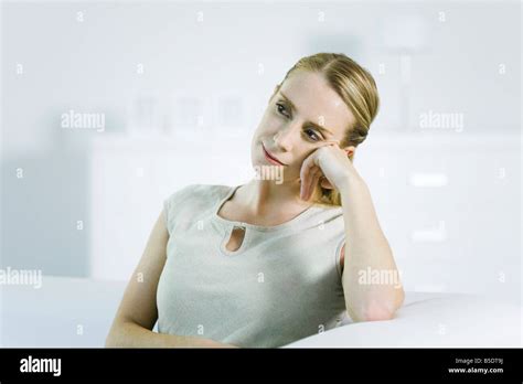 Woman Leaning On Elbow Looking Away Stock Photo Alamy