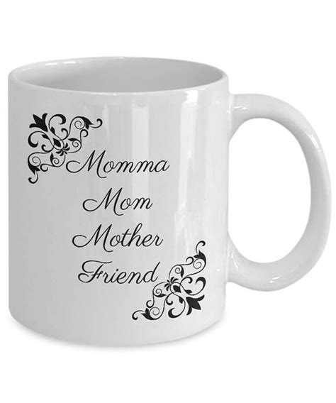 A White Coffee Mug With The Words Momma Mother And Friend On Its Side