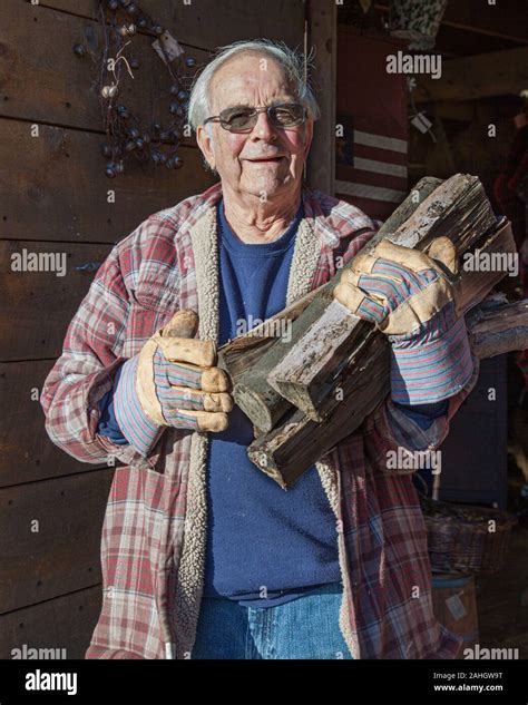 Man Carrying Wood For His Wood Stove Stock Photo Alamy