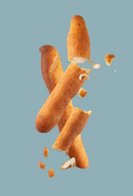 Premium Photo Bread Sticks Grossini On A Blue Background Flying Food