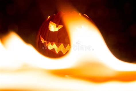 Spooky Carved Halloween Pumpkin In Hot Burning Hell Fire Flames Stock