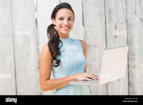 Stylish Brunette Using A Laptop Stock Photo Alamy