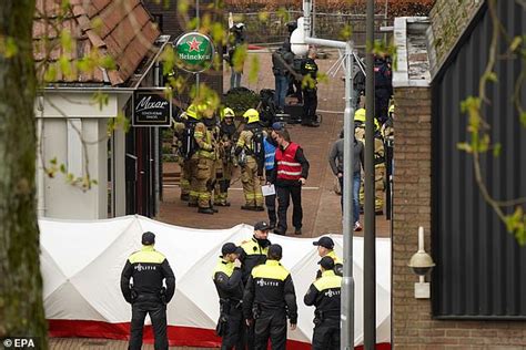 Netherlands Hostage Incident Masked Man Puts His Hands In The Air And