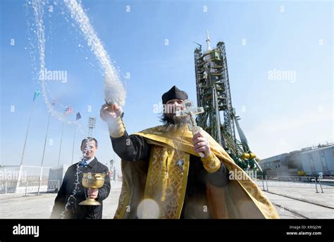 An Orthodox Priest Blesses Members Of The Media On The Soyouz Launch