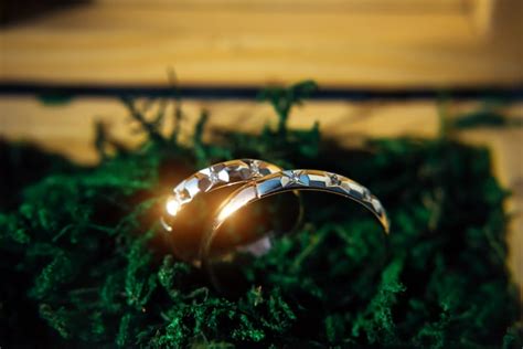 Premium Photo Two Sparkling Wedding Rings Close Up Gold Wedding