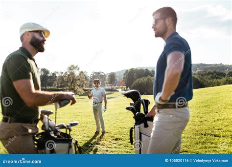 Golf Player Walking And Carrying Bag On Course During Summer Gam Stock