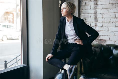 Pretty Blonde Girl Sitting On The Couch In A Hat Stock Photo Image Of Posing Girl