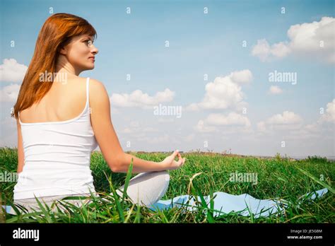 Young Girl Doing Yoga Lotus Pose In The Park Stock Photo Alamy