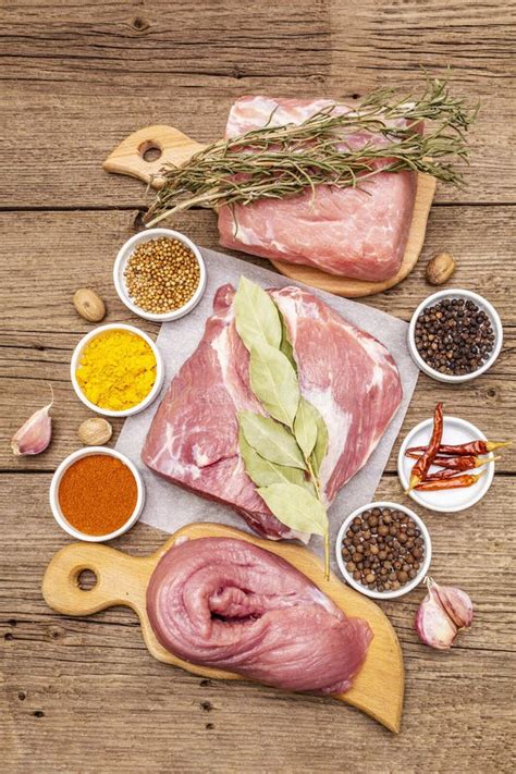 Assorted Various Fresh Pork Cuts Raw Meat With Spices Stock Photo