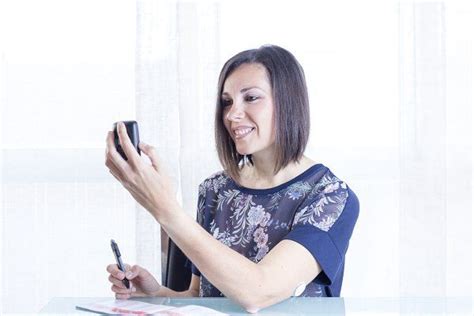 Smiling Woman Checking Glucose Reader