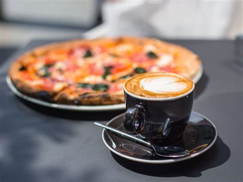 Pizza And Coffee On Wooden Table Cup Of Cappuccino Stock Photo