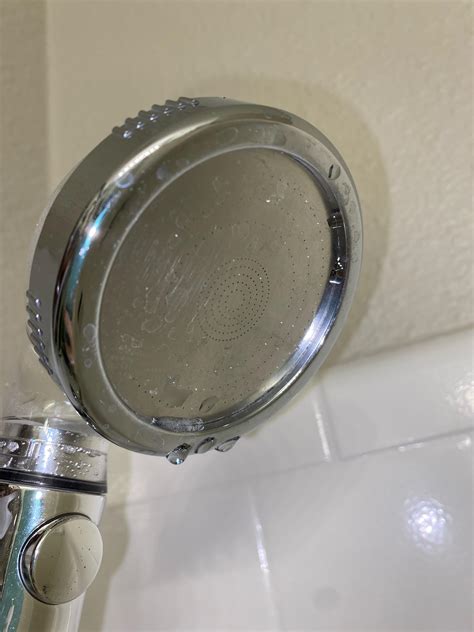 How do i properly clean my shower head???? Some of the holes are ...