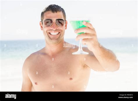 Portrait of man drinking cocktail Stock Photo - Alamy