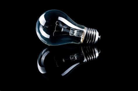 Premium Photo Classic Light Bulb On Black Background