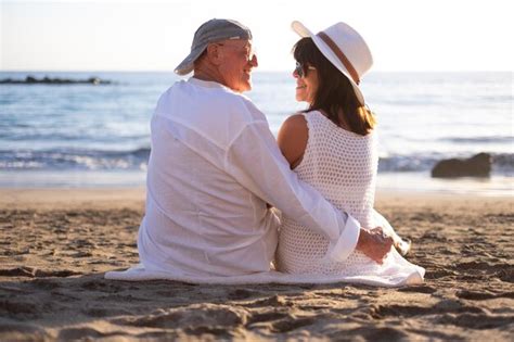 Premium Photo Rear View Of Bonding Senior Couple Hugging Sitting On