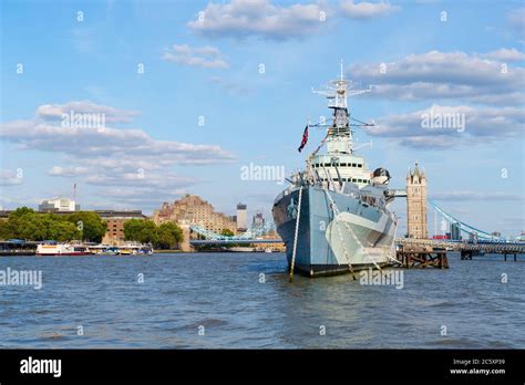 The Hms Belfast Warship Docked Near Tower Bridge On The River Thames In