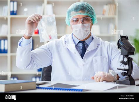 Forensics Investigator Working In Lab On Crime Evidence Stock Photo Alamy