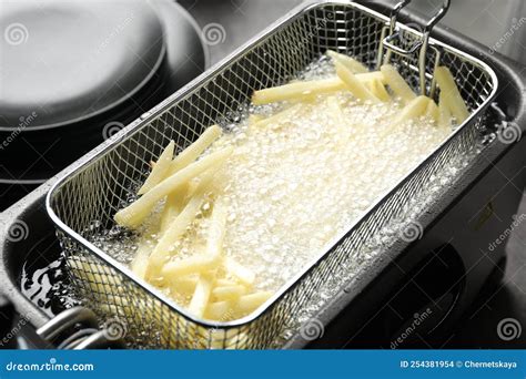 Cooking French Fries in Hot Oil Stock Photo - Image of fryer, lunch ...