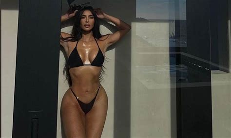 Kim Kardashian Flaunts Her Curves In Neon Pink Thong Zip Up Bikini