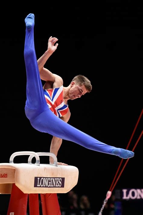 Male Gymnast Performing Impressive Tricks on Balance Beam