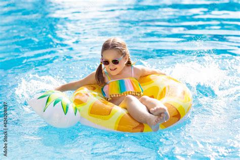 Child in swimming pool. Summer vacation with kids. Stock Photo | Adobe ...