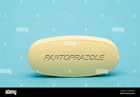 Pantoprazole pill, conceptual image Stock Photo - Alamy