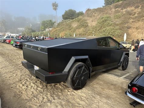 Tesla S Head Designer Drove A Black Cybertruck To A Car Show And