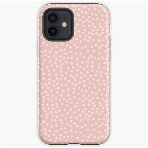 A Pink Iphone Case With White Polka Dots