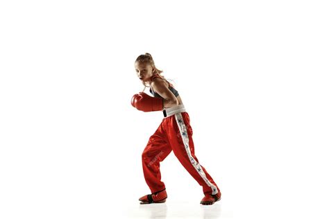 Free Photo Young Female Kickboxing Fighter Training Isolated On White