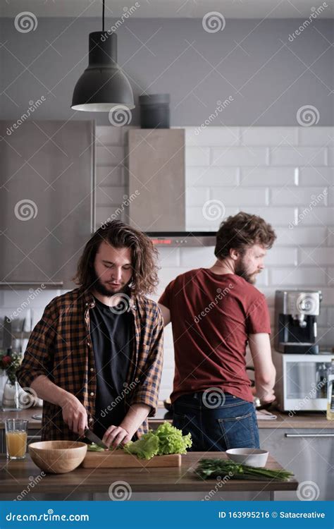 Friends Cooking Dinner Together In The Kitchen Stock Photo Image Of