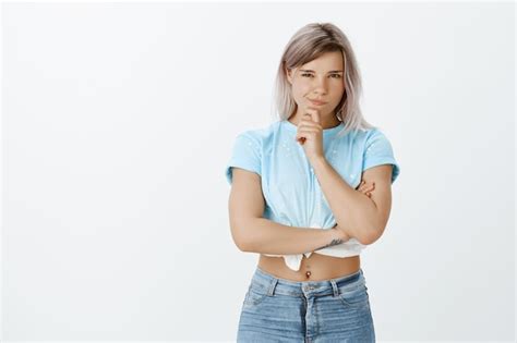 Free Photo Portrait Of Intrigued Blonde Girl Posing In The Studio
