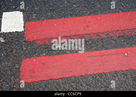 Red Route double red lines on road, UK Stock Photo - Alamy