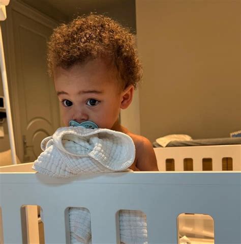 Kylie Jenners Son Aire 14 Months Adorably Poses Wide Eyed In His Crib — See The Photo