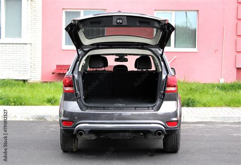 Crey car is ready to load luggage. Clean trunk wagon car. Modern SUV ...