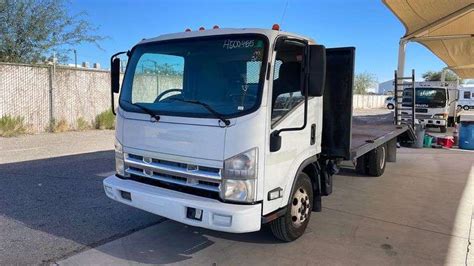 2011 Isuzu NPR Flatbed Truck Sierra Auction Management Inc