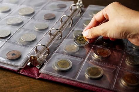 Premium Photo Old Collectible Coins On A Wooden Table Dark Background