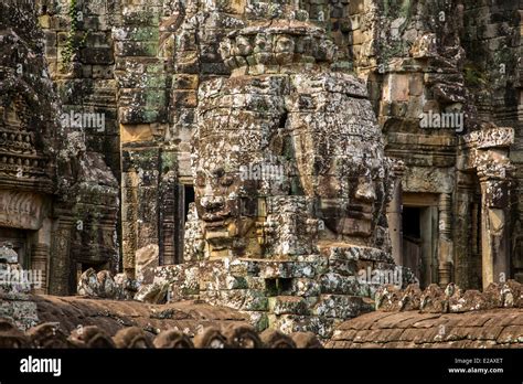 Stone Faces On The Towers Of Ancient Bayon Temple In Angkor Thom