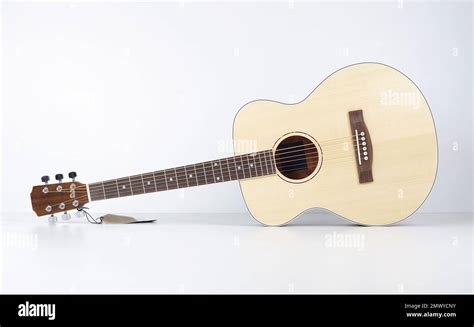 Musical Instrument Front View Classic Wooden Left Hand Acoustic Guitar On A White Background