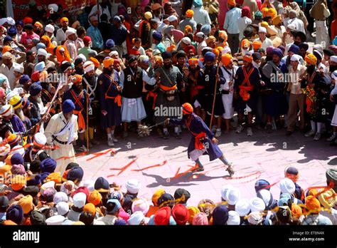 Nihang Or Sikh Warriors Performing Stunts With Weapon In During Hola