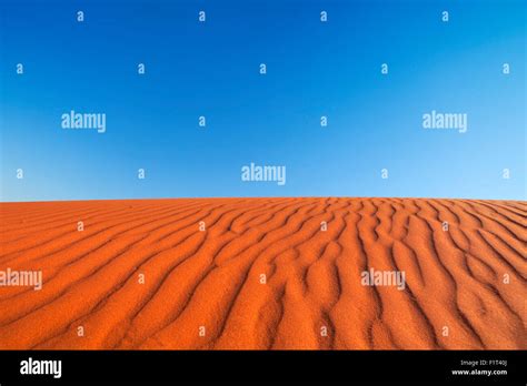 Detail Of Ripples In A Red Sand Dune On A Clear Day Photographed In