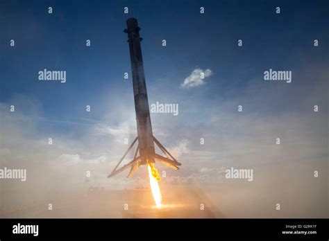 The SpaceX Falcon 9 reusable launch vehicle fires booster rockets as it ...