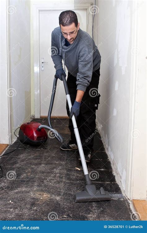 Workman Vacuuming A Passage During Renovations Stock Image Image Of