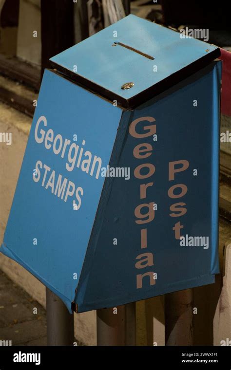 Traditional Blue Mail Collection Box With Letter Slot On A Main Street