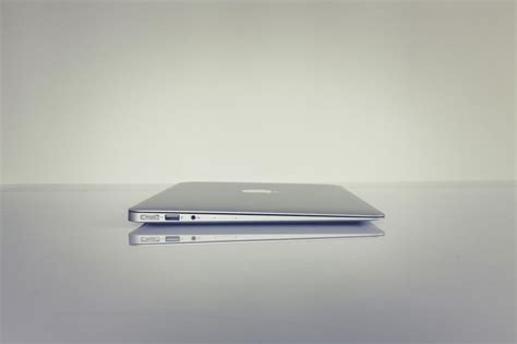 Free Stock Photo Of Minimalist Shot Of A Closed Macbook Against