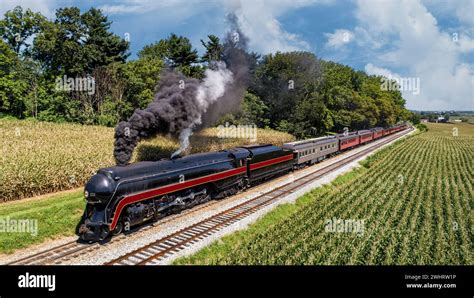 An Aerial Front View Of A Restored Antique Steam Passenger Train