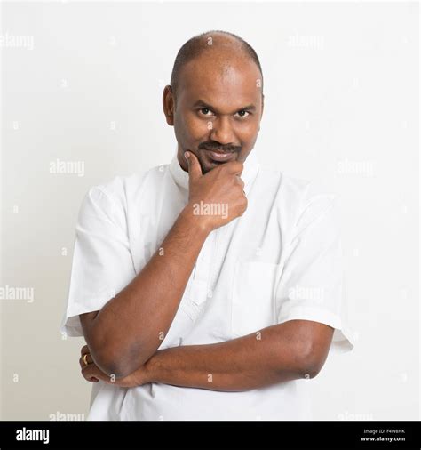 Portrait Of Mature Casual Business Indian Man Looking At Camera And