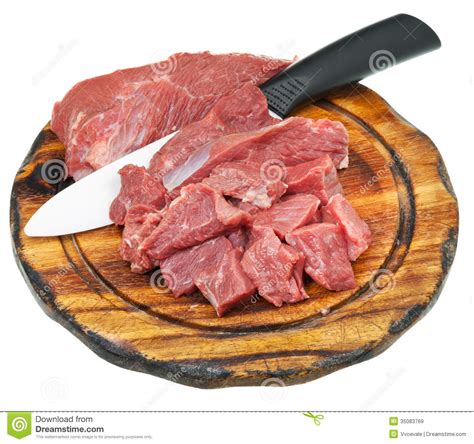 Cut Raw Meat And Ceramic Knife On Cutting Board Royalty Free Stock