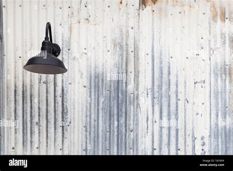 Old Rusty Sheet Metal And Lamp Abstract Background Texture Stock Photo