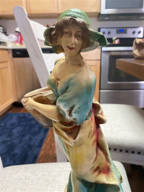 I Have A 15 Inch Figurine Of A Barefoot Peasant Woman Carting A Large