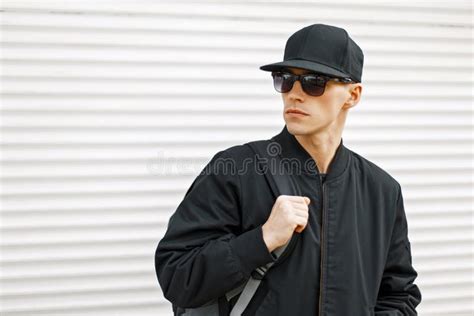 Handsome Young Man with Sunglasses in a Black Baseball Cap Stock Photo ...